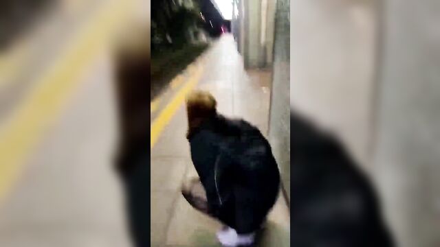 Girl pees in the train station, almost gets caught
