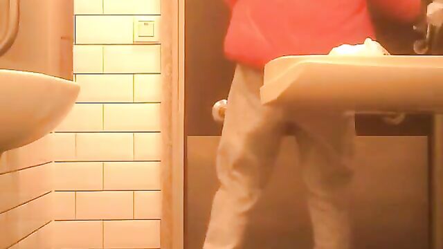 A hot woman was caught peeing in the bathroom, looking amazing