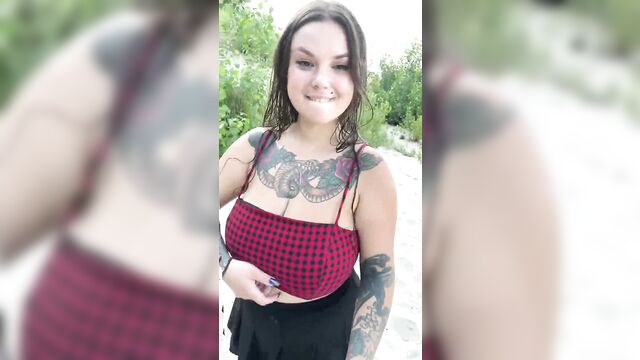 Tattooed big tits girl makes love on the beach
