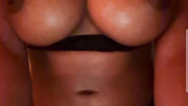 Perfect ebony girl with big tits playing with her boobs on cam
