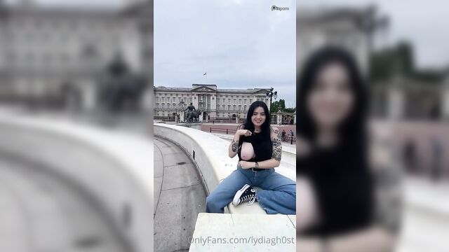 A girl is flashing her tits on the street
