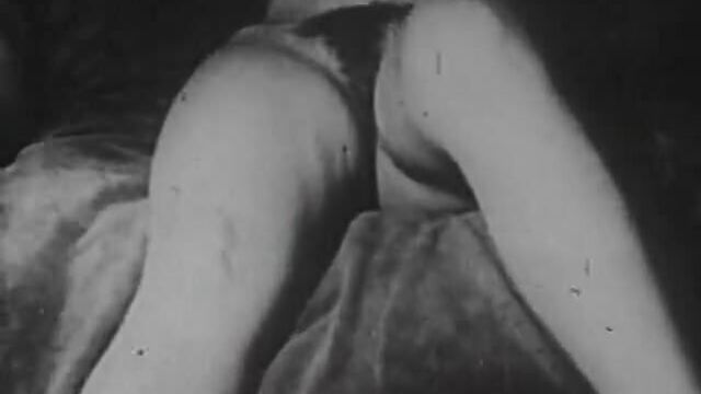 Two naked chicks pleasing each other (1930s vintage)