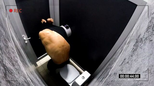 Camera in a men's public toilet. peeping