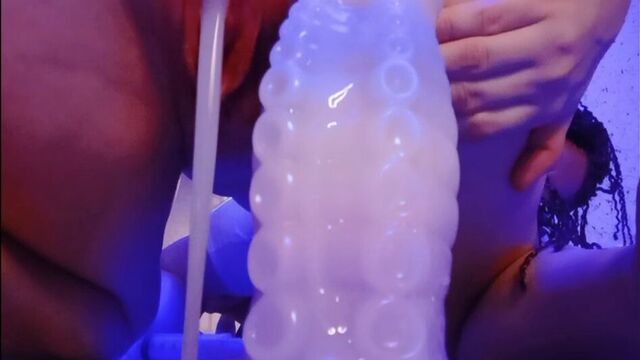 Squirting dildo fills tight pussy